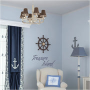 Treasure Island vinyl wall decal by The Simple Stencil applied to a blue pirate themed boy's room and really adds a finishing touch to the decor. 