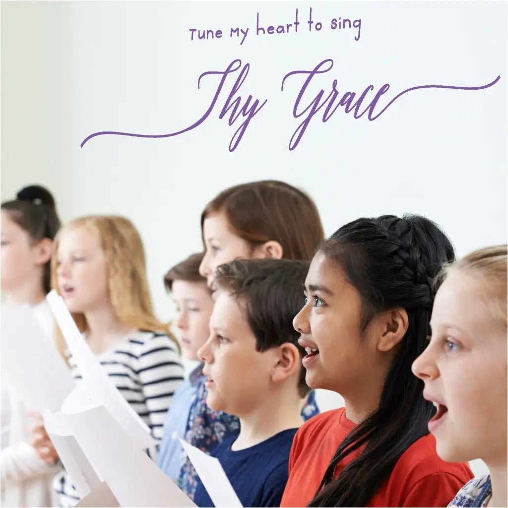 Tune my heart to sing thy grace vinyl wall decal displayed behind a childrens church choir group