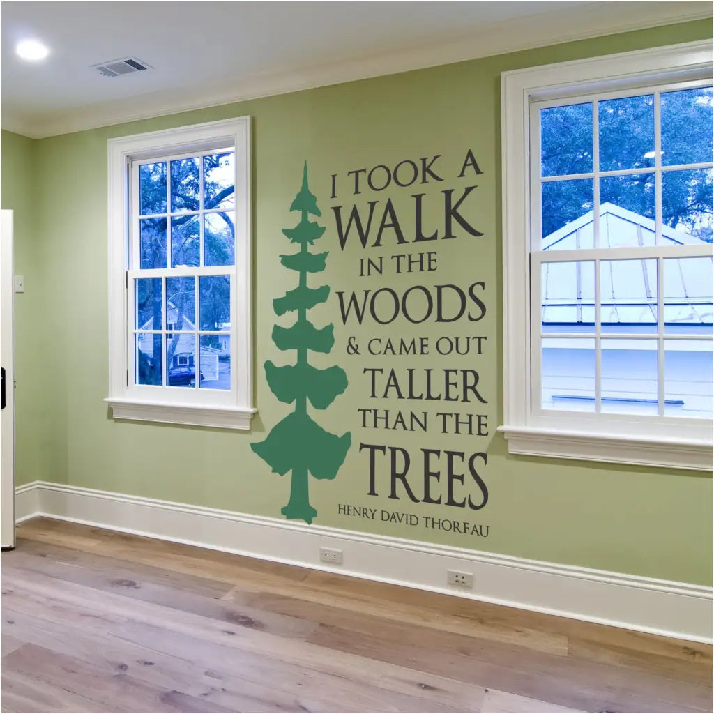 I took a walk in the woods & came out taller than the trees. Henry David Thoreau quote made into a beautiful vinyl wall decal that includes a large tree decal graphic alongside this inspirational quote by Thoreau