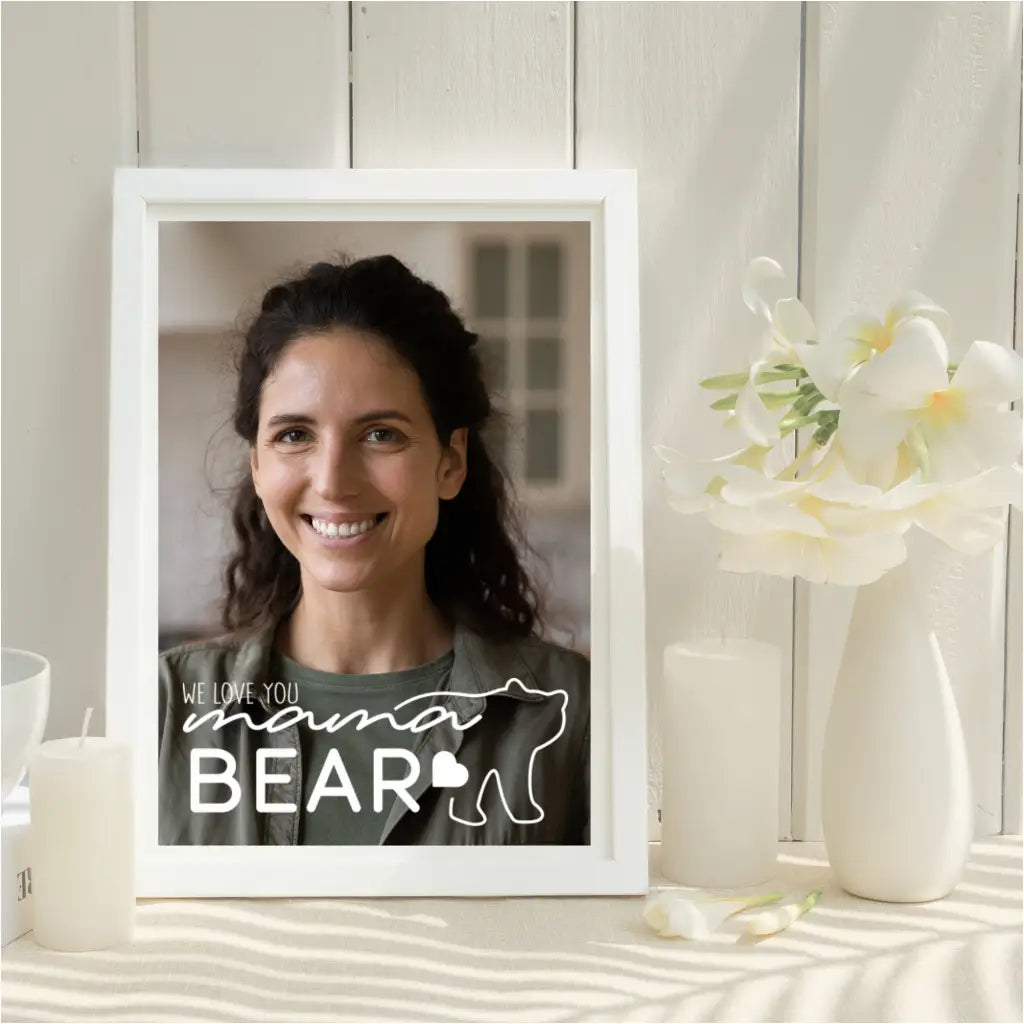 A photo frame featuring a picture of Mom smiling, with the "We Love You Mama Bear" decal applied in a antique white vinyl directly onto the frame.
