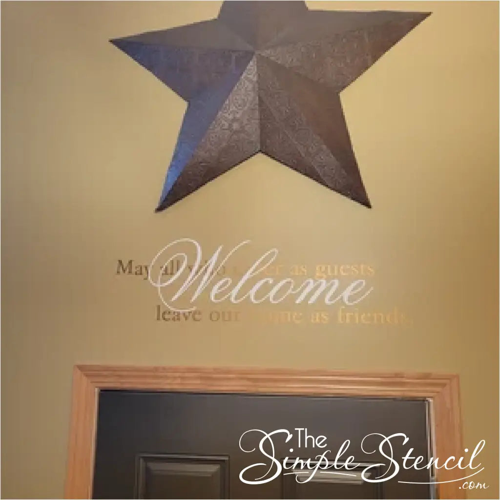Customer supplied picture of Welcome May All Who Enter As Guests Leave our home as friends Wall Decal shown in Antique White and Gold Vinyl over a doorway.  - Design and decal supplied by The Simple Stencil
