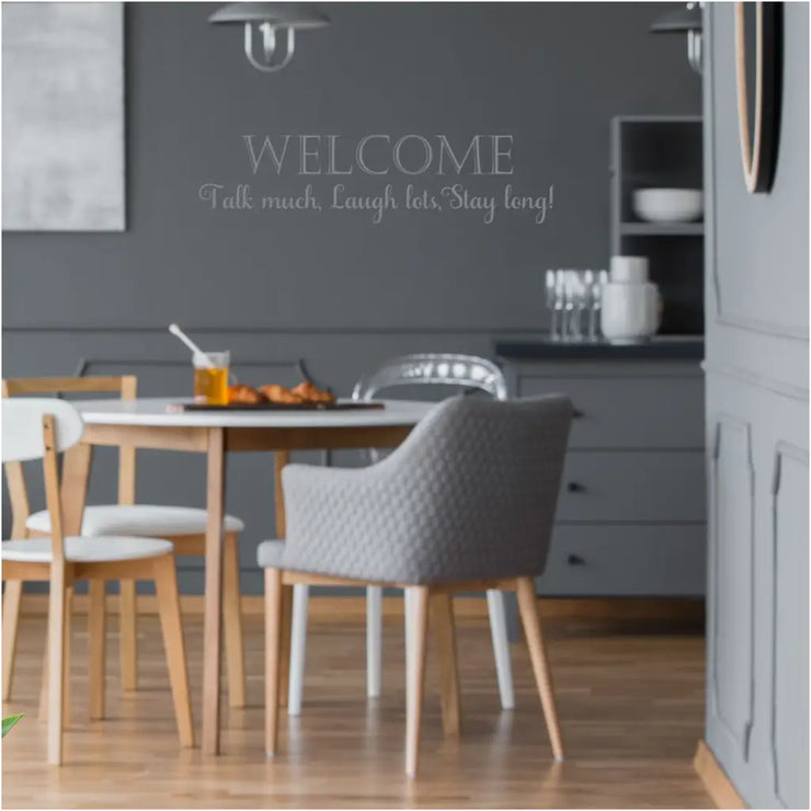 Welcome - talk much, laugh lots, stay long! Beautifully designed premium vinyl wall art decals by The Simple Stencil