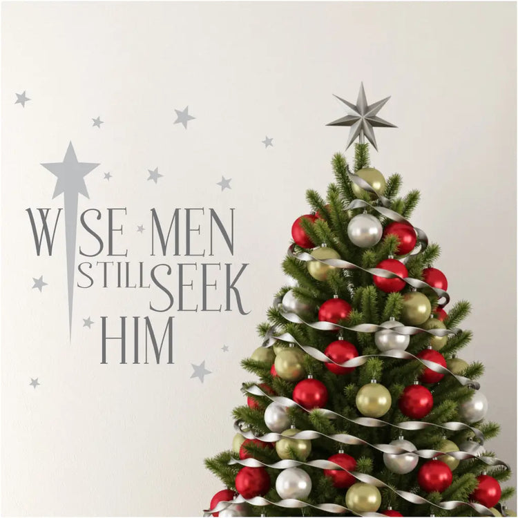 A pretty vinyl wall decal for a Christian Christmas reads: Wise men still seek Him and is surrounded by stars in your choice of color to match your Christmas decor. 