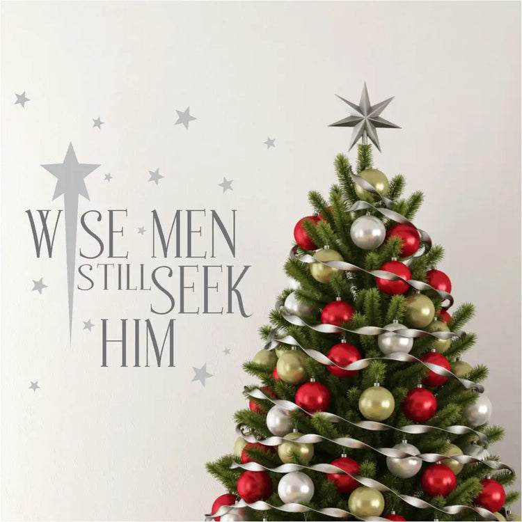 A pretty vinyl wall decal for a Christian Christmas reads: Wise men still seek Him and is surrounded by stars in your choice of color to match your Christmas decor. 