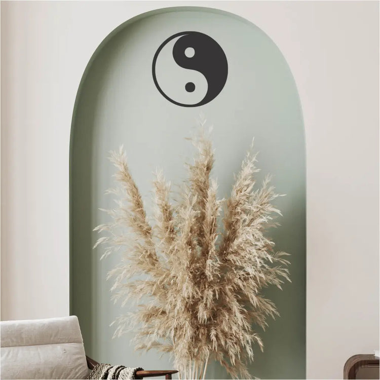 Beautiful home decor with a yin yang decal installed over a pretty arrangement in a sitting area will help remind of balance during contemplative moments. 