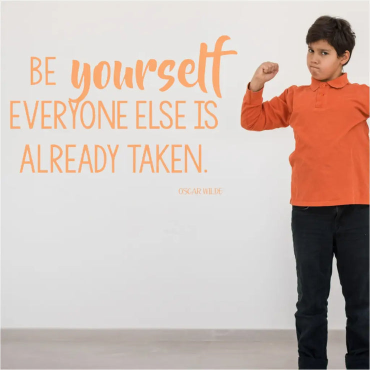 Large wall decal displayed on a wall to inspire kids of all ages to Be yourself, everyone else is already taken. Oscar Wilde