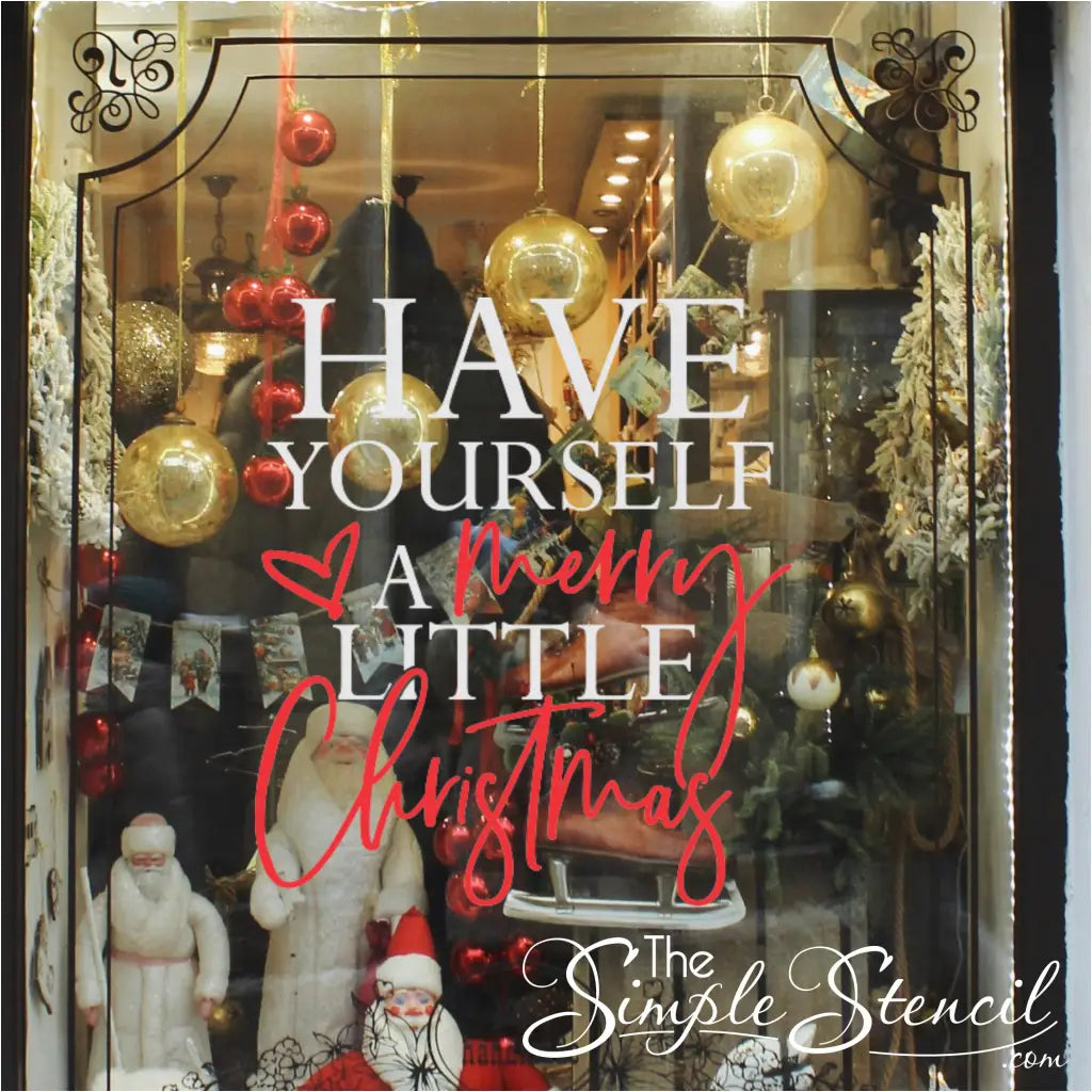 White and red storefront decoration on a retail window reading 'HAVE YOURSELF A merry LITTLE Christmas'. Highlights the decal's use as a large commercial window vinyl for boutique window displays and seasonal promotions.