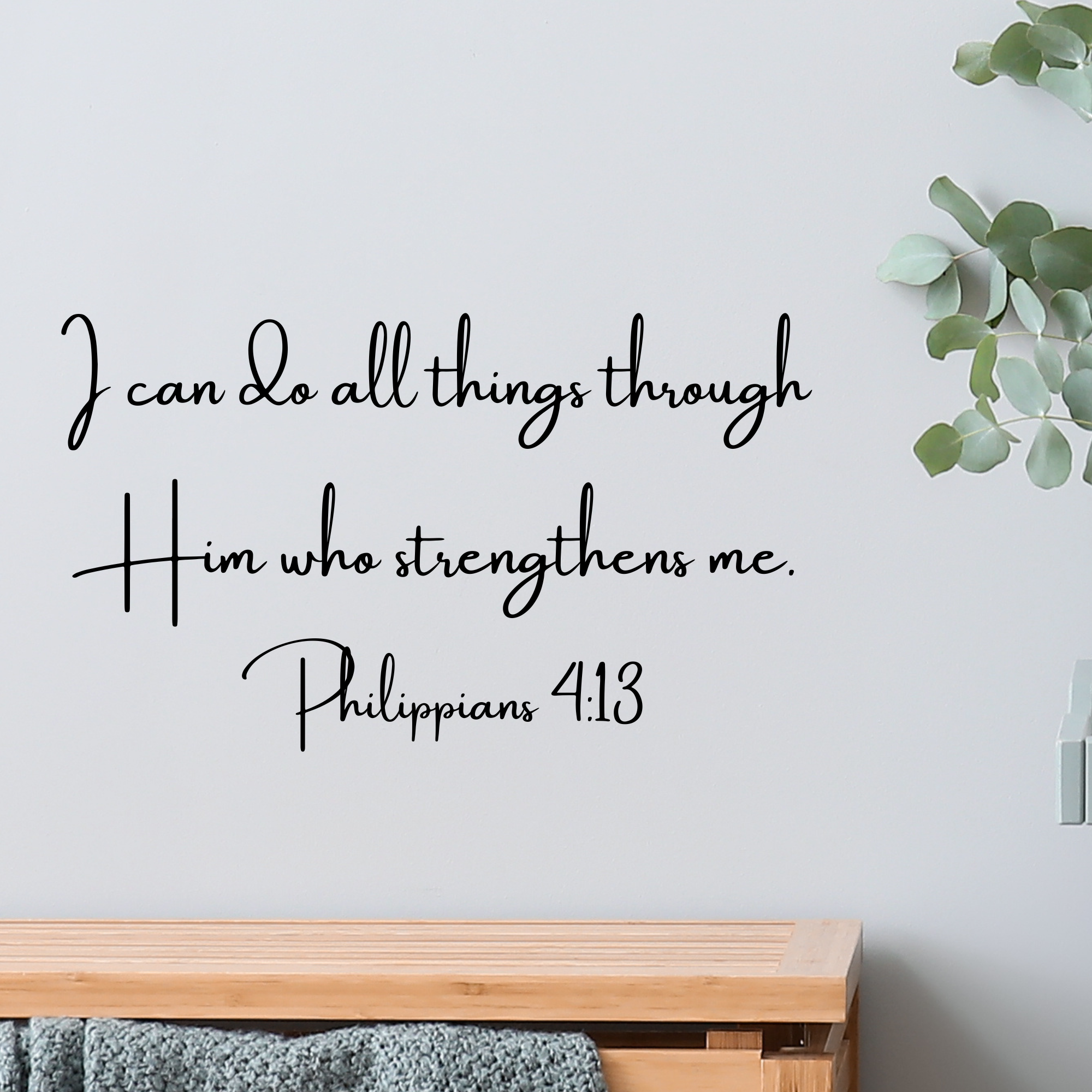 Uplifting Scripture wall decal featuring a Bible verse in a modern font displayed on a living room wall.