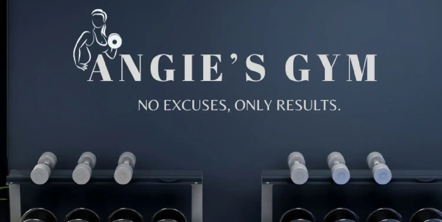 Blue fitness center wall showcases powerful "Angie's Gym" logo with fierce woman graphic & "No excuses, only results." quote. Empowering atmosphere motivates members.