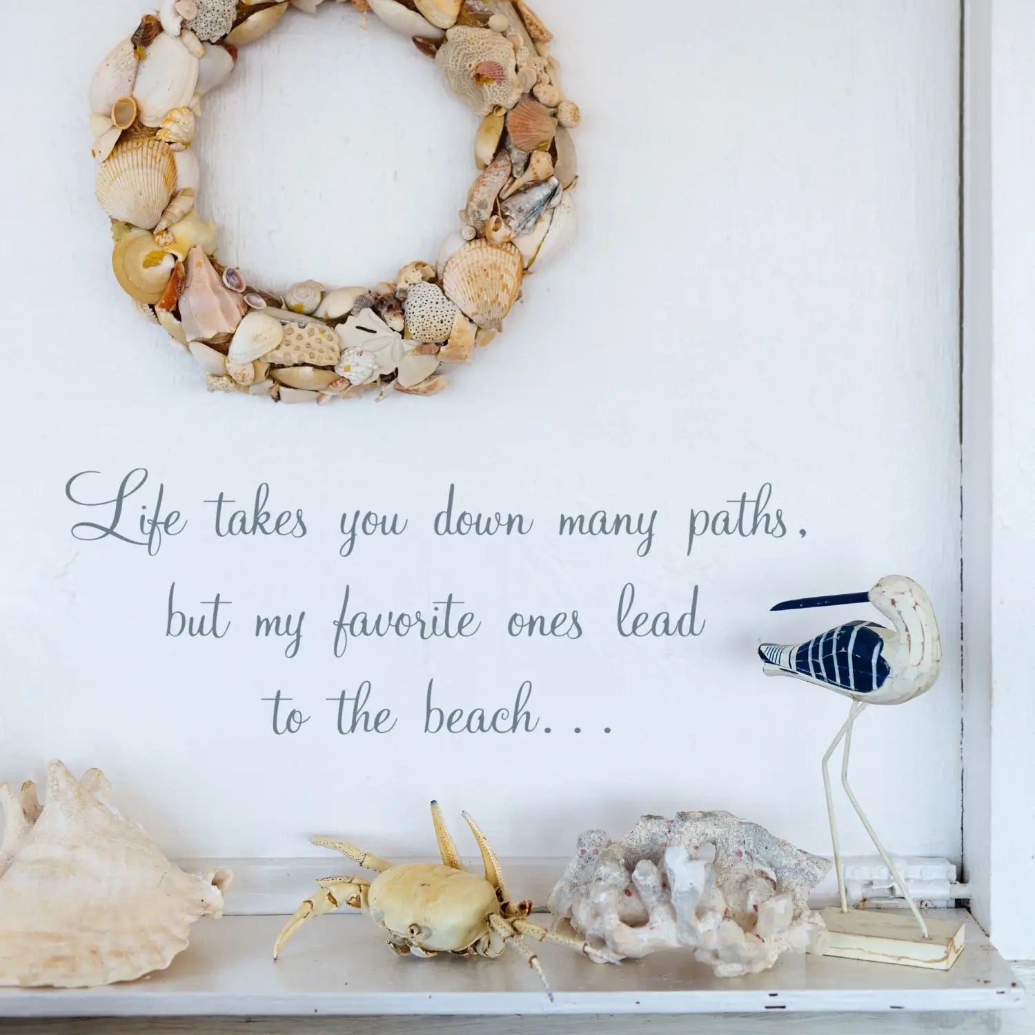 Beautiful summer decor using wall decals. A Simple Stencil display with a nautical theme showing a wall decal that reads: Life takes you down many paths, but my favorite ones lead to the beach...