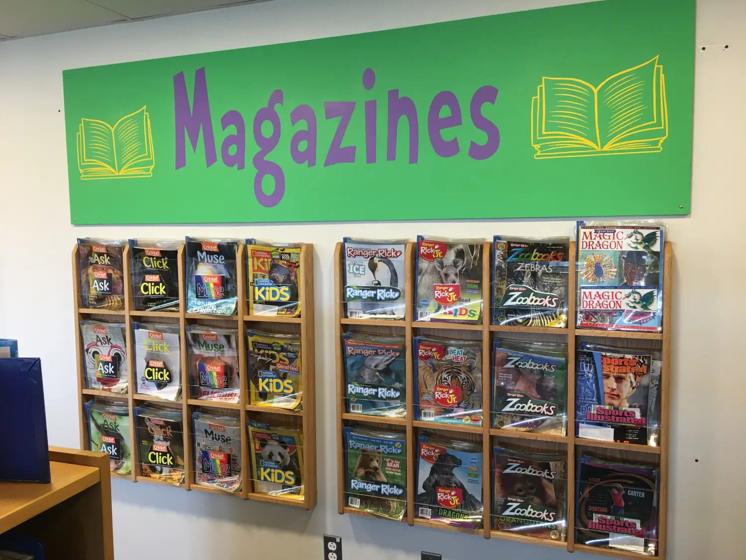 Magazine Rack in School Library - Great Display Idea by Librarian at JFK School Library using Simple Stencil Custom Wall Decals