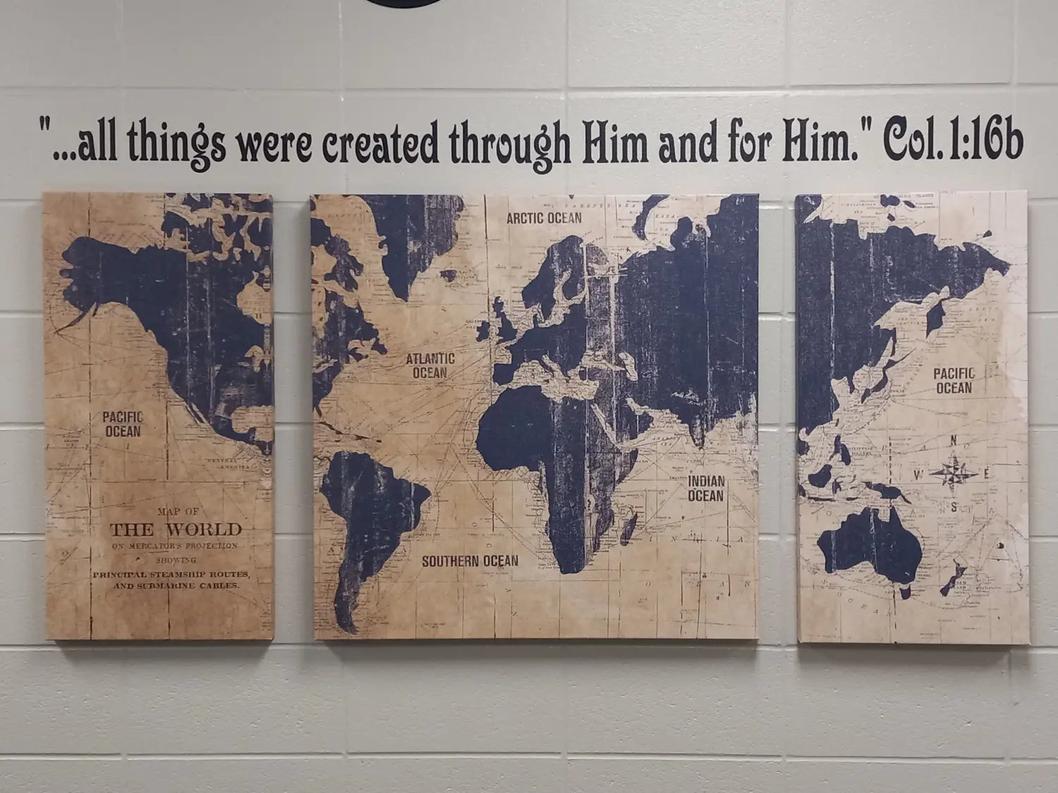 Custom bible verse wall decal display over a world picture that reads ...all things were created through Him and for Him. Col. 1:16b - Created by TheSimpleStencil.com 