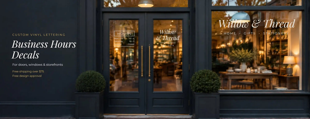 Custom vinyl business hours decals on a boutique storefront: boxed store hours on the glass door, shop name on the window
