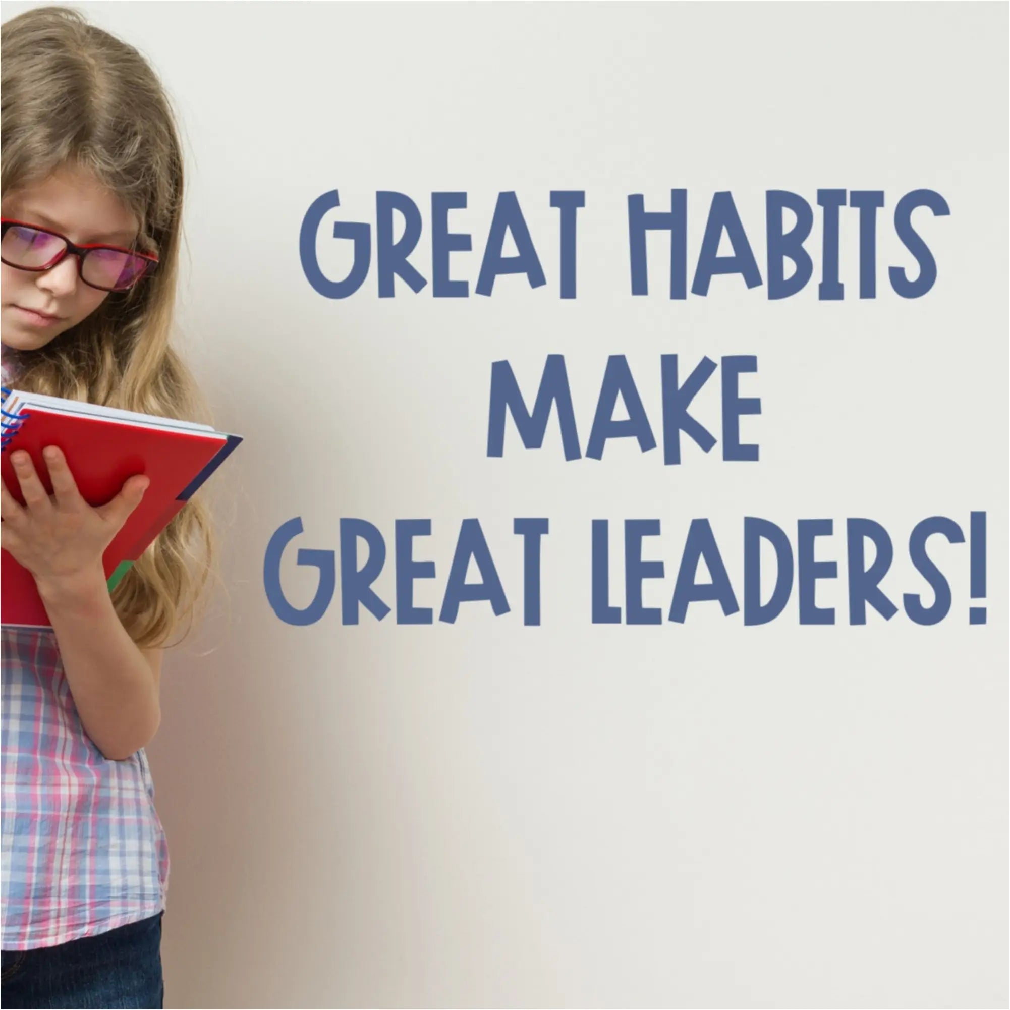 Inspiring blue vinyl wall decal quote displayed on a school wall, featured in The Simple Stencil blue wall decals collection.