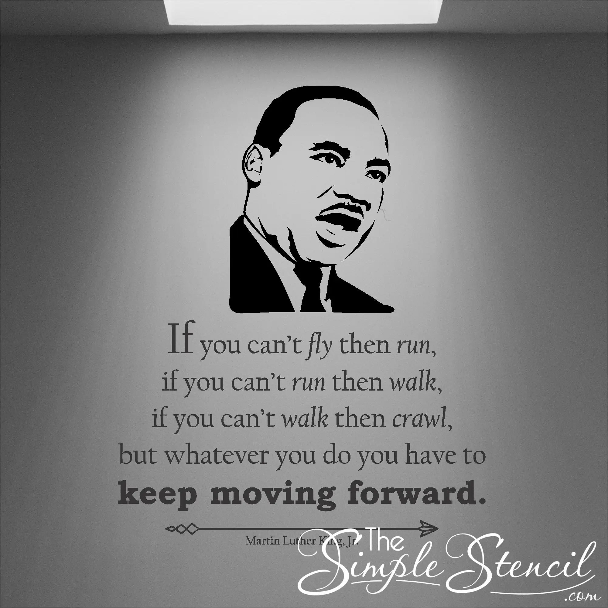 Classic matte black vinyl wall decal quote displayed on a light neutral living room wall, featured in The Simple Stencil black wall decals collection.