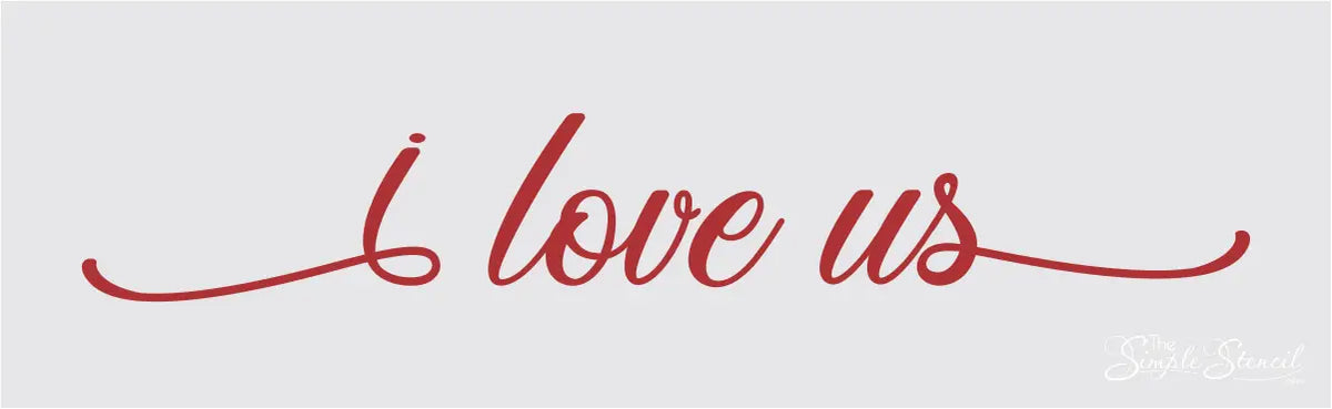 Red "I love us" vinyl wall decal displayed in a cozy living room, featured in The Simple Stencil red wall decals collection.