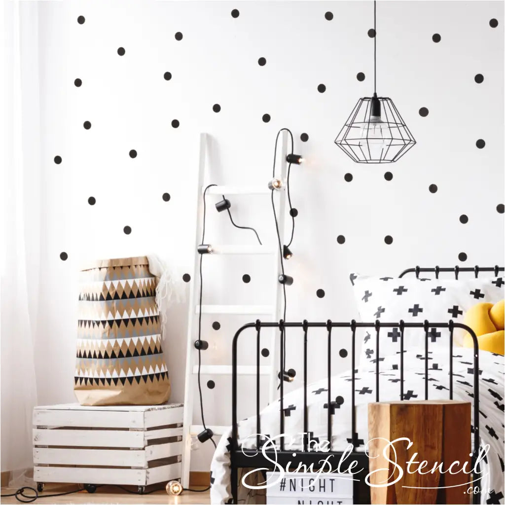 Set of polka dot vinyl decals in black displayed on a teen's bedroom wall create a fun look in your home decorating projects kids will love.
