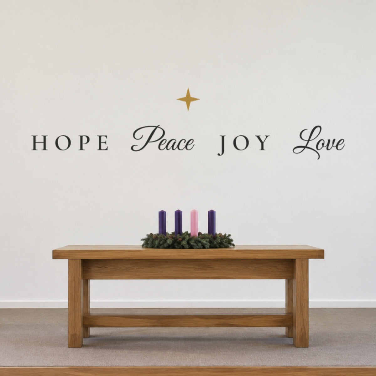 Hope Peace Joy Love Advent wall decals hung in one row with a gold star above a church communion table and Advent wreath