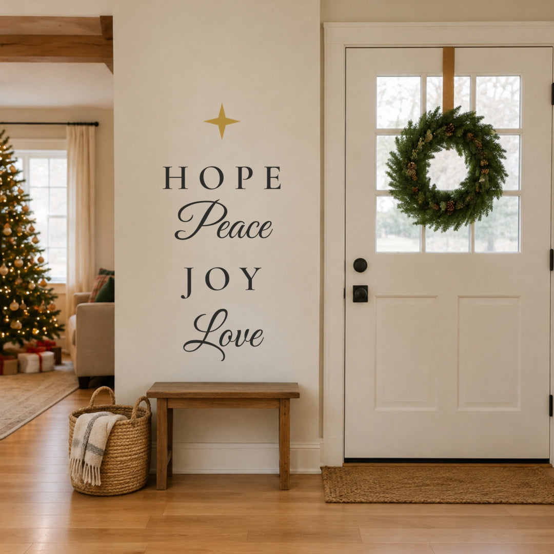 Stacked Hope Peace Joy Love Advent wall decals with gold star on a narrow wall beside a front door at Christmas