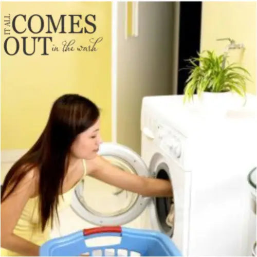 A cute vinyl wall decal for your laundry room walls that reads: It all comes out in the wash.