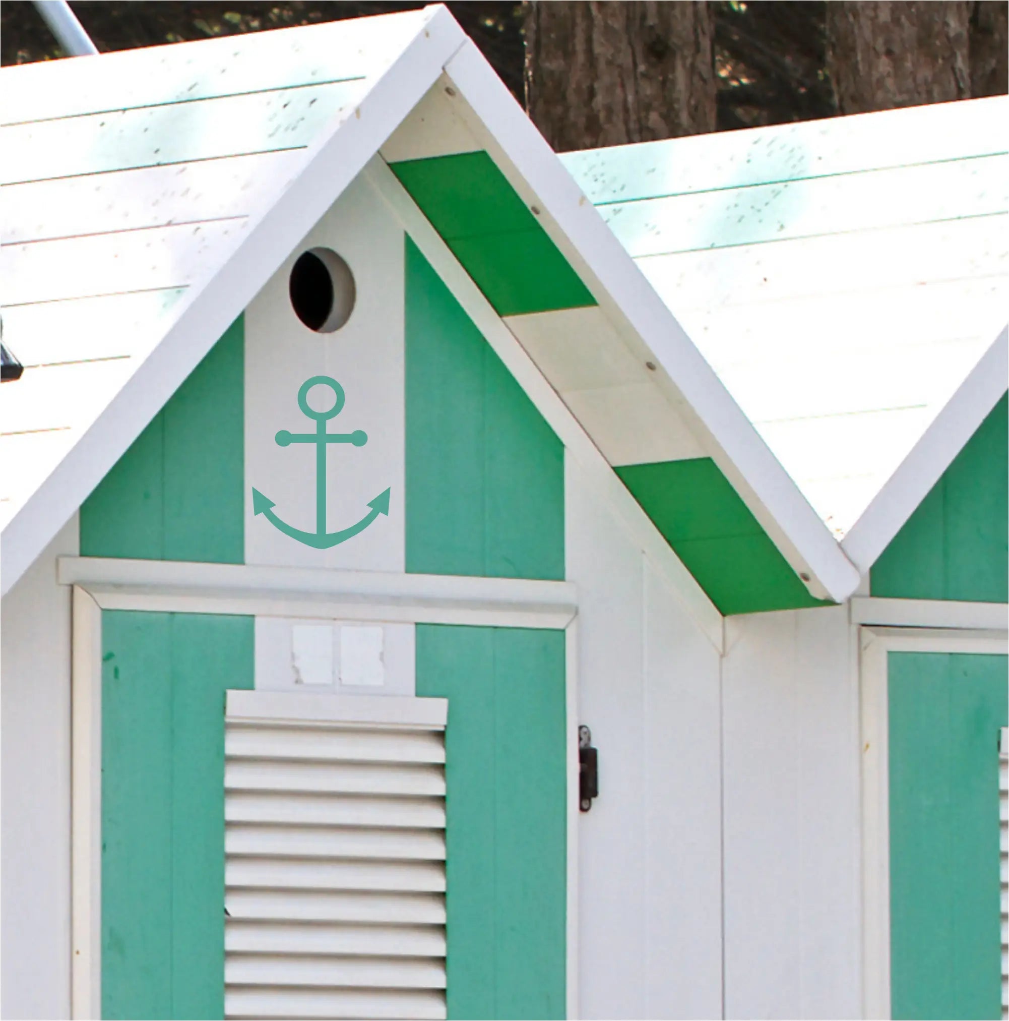 A removable large vinyl anchor graphic decal applied to the exterior beach house changing room. Can be applied to any smooth surface to give an instant nautical vibe. The Simple Stencil Beach Related Decals
