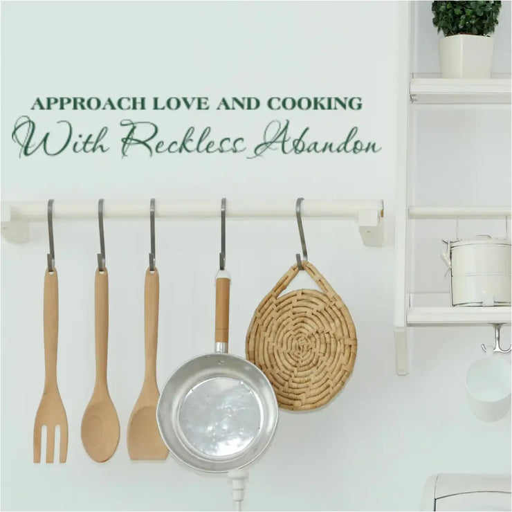 This pretty kitchen / pantry wall displays an adorable Simple Stencil wall decal that reads: Approach love and cooking with reckless abandon.