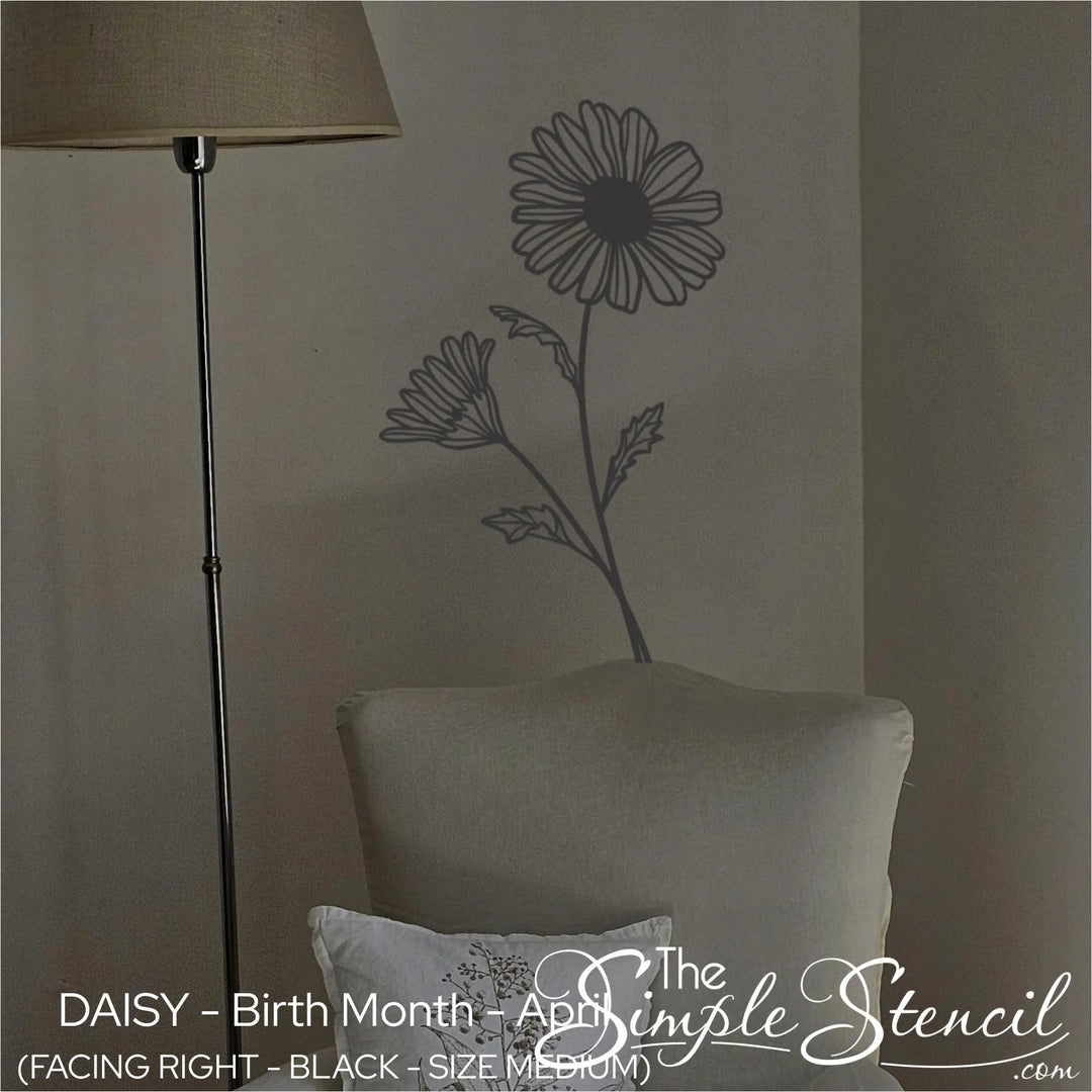 Black Daisy birth flower wall lettering placed in a cozy reading corner behind a neutral linen chair for a grounding aesthetic.