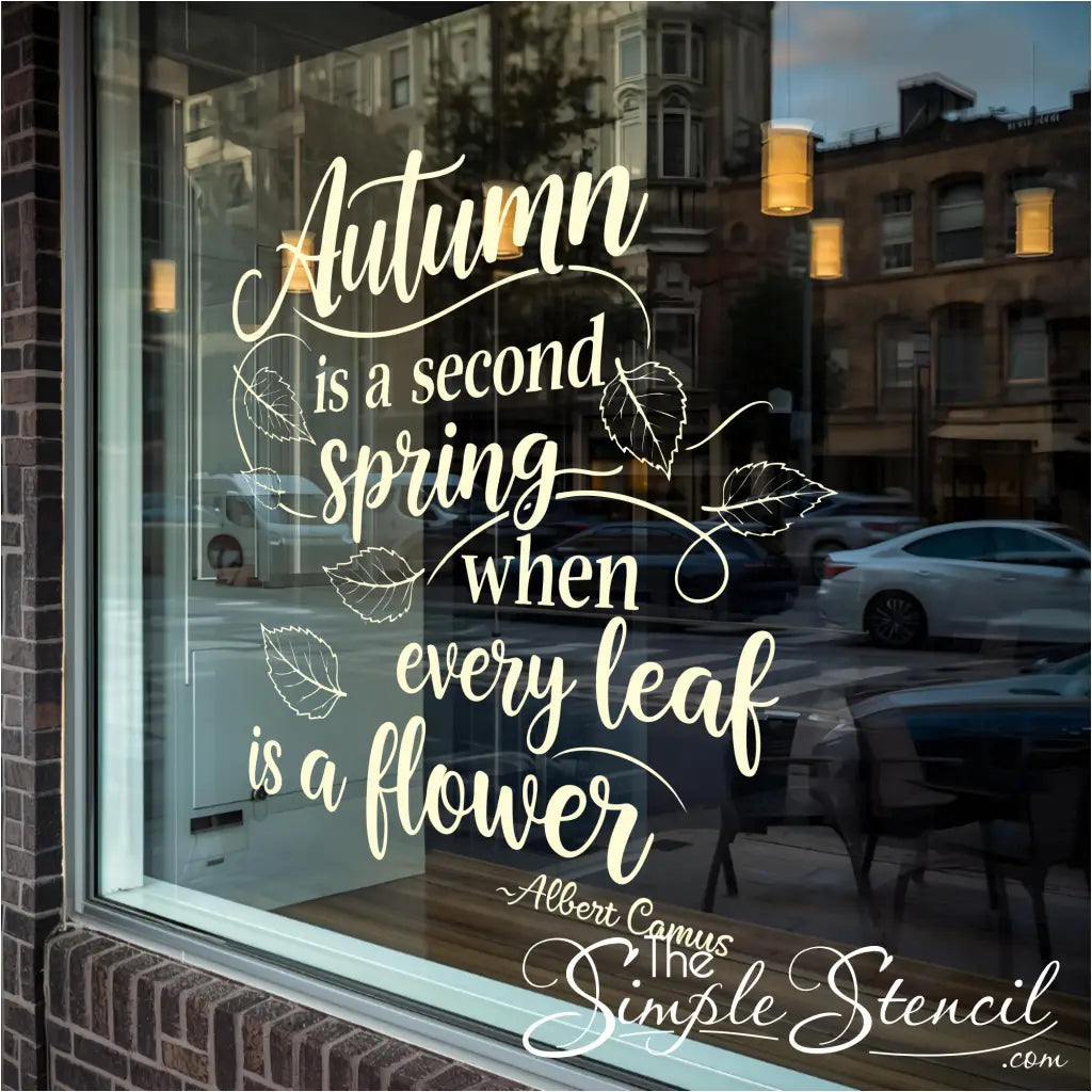 Decorative window with autumn-themed quote and leaf illustrations.