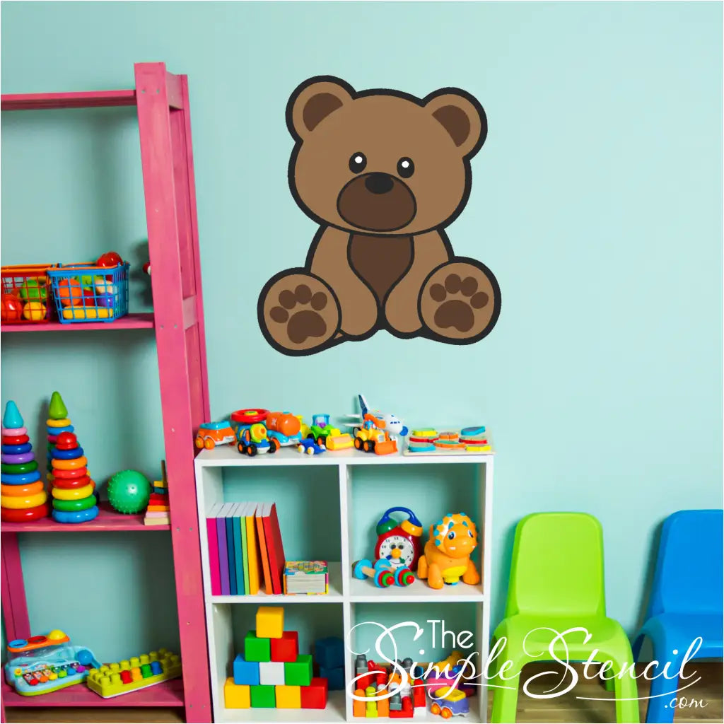 Brown cub bear wall decal applied on a nursery wall with a moon and stars theme.