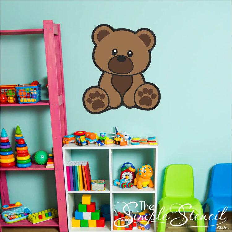 Brown cub bear wall decal applied on a nursery wall with a moon and stars theme.