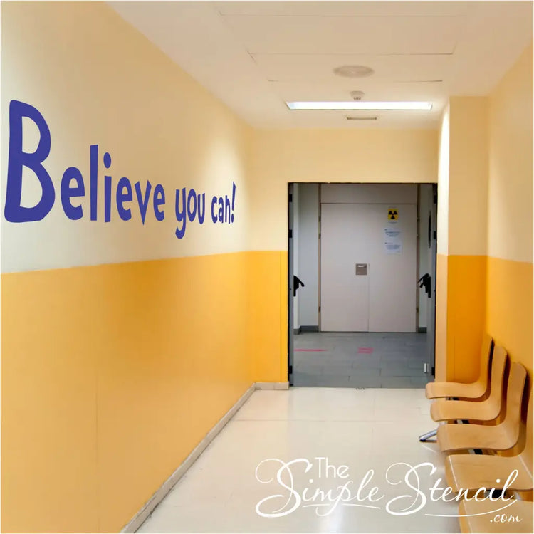 A large vinyl wall decal in a school hallway where it can inspire students between classes reads: Believe you can! in a fun font.
