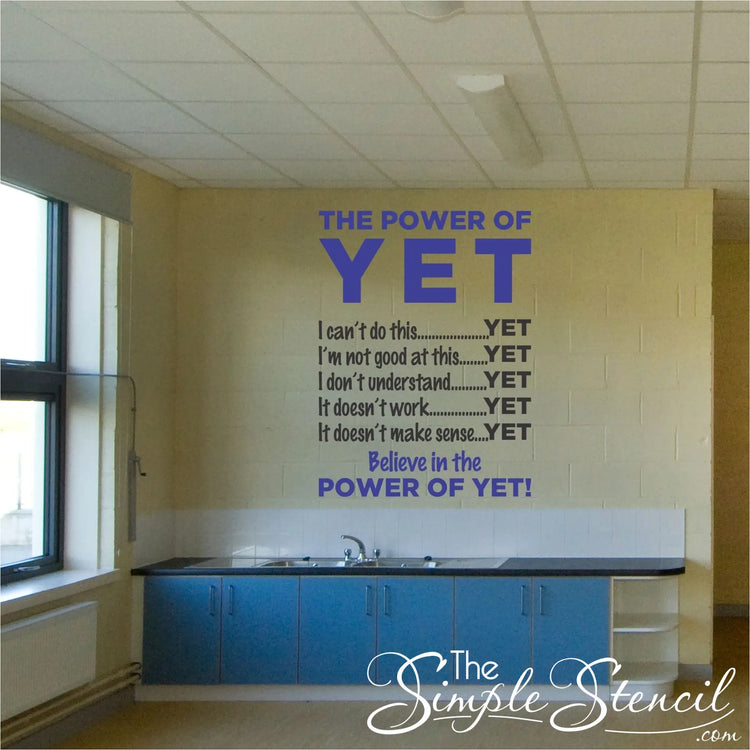 A two color Power of Yet vinyl wall decal applied to an empty classroom wall to encourage and motivate students to keep believing in themselves. 
