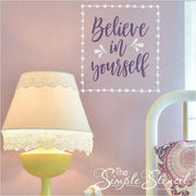 Believe in Yourself vinyl wall decal in white and purple on a pink wall. A great Simple Stencil design for a girls room with it's whimsical pattern. 