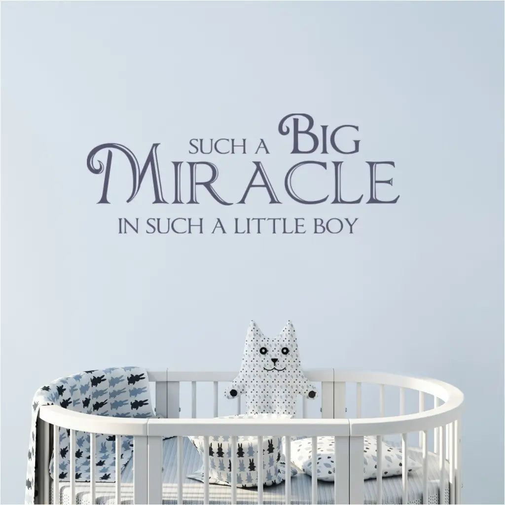 A super cute vinyl wall decal for a baby boy's nursery by The Simple Stencil that reads: Such a big miracle in such a little boy.