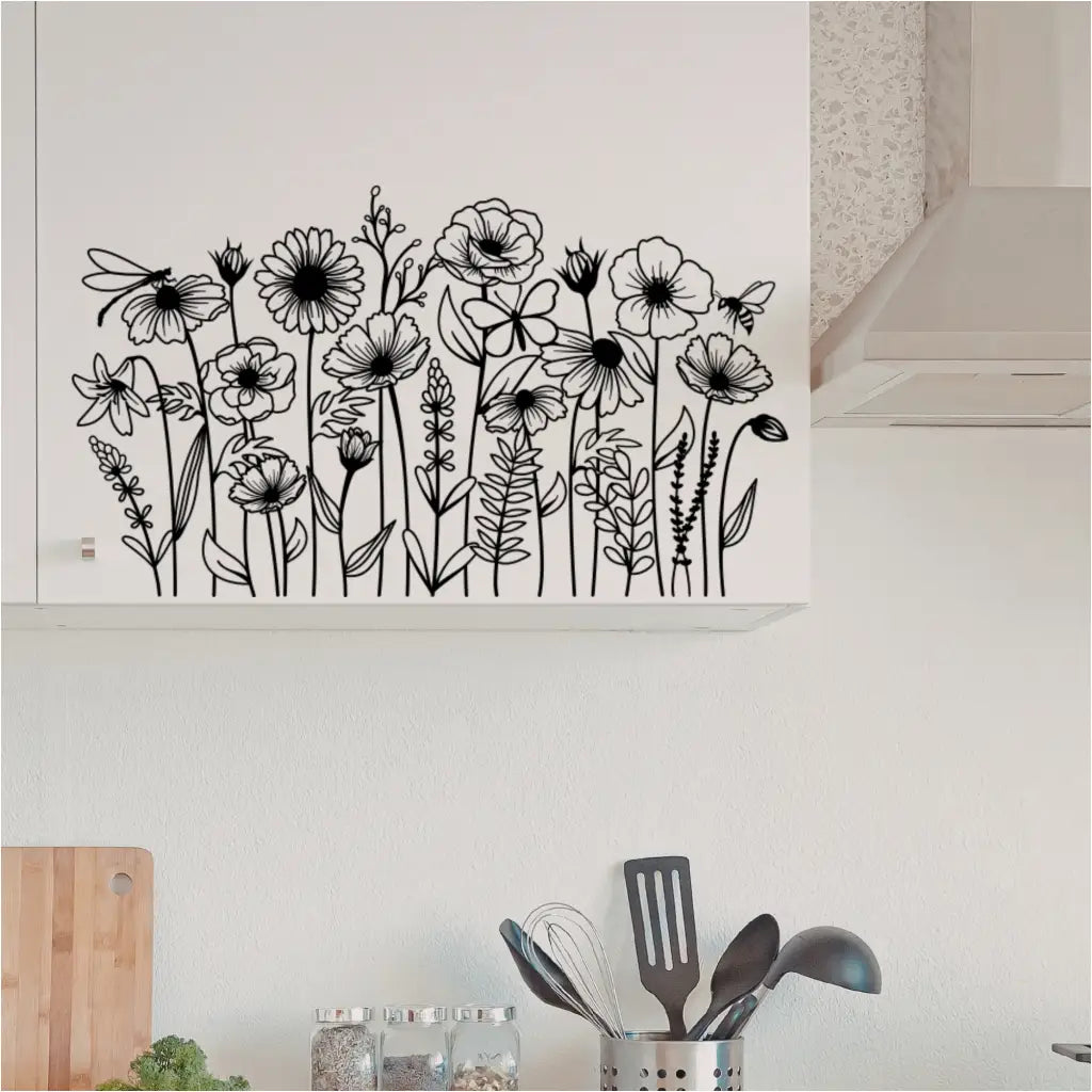 Biophilic Style Endro 1 wildflower decals applied to white modern kitchen cabinets above a counter with spices and utensils.