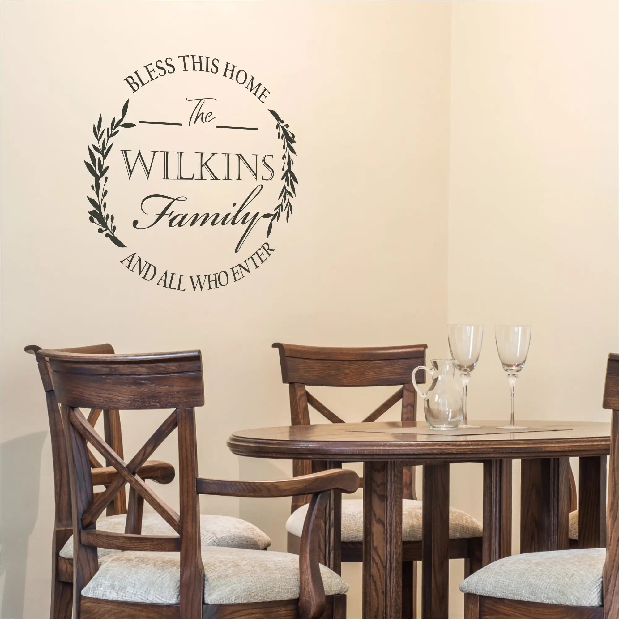 A beautiful round vinyl decal wall monogram that displays your family name and is surrounded by the words that reads: Bless this home and all who enter with laurel wreath emements. 