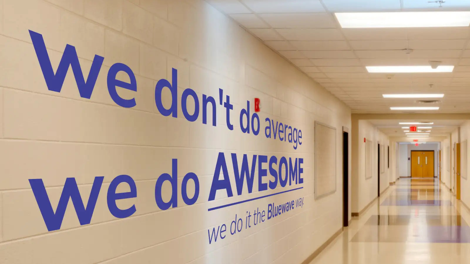 Blue wall decal with the text ’we don’t do average.