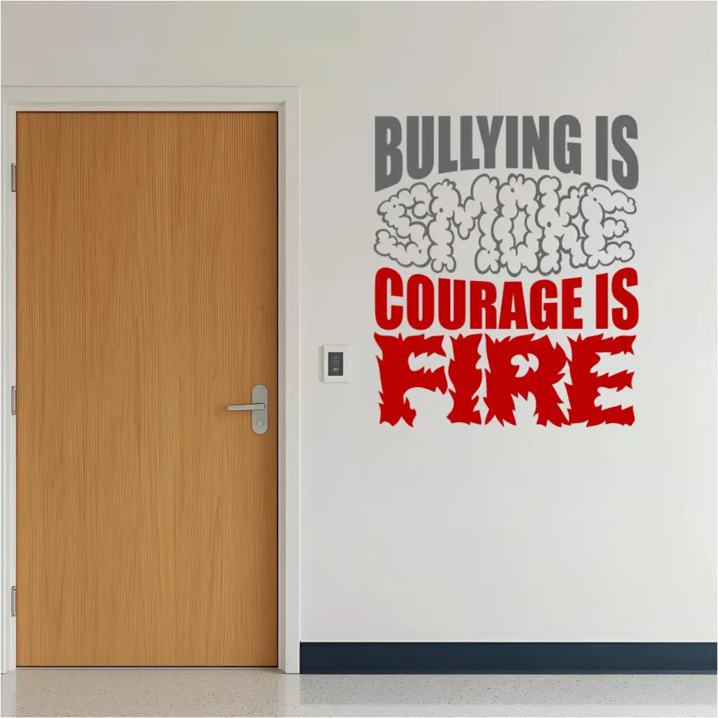 A full view of the "Bullying is Smoke, Courage is Fire" decal shown as a mockup on a light-colored wall in a classroom or school hallway setting. The decal is displayed at eye level, showcasing its size and potential placement.
