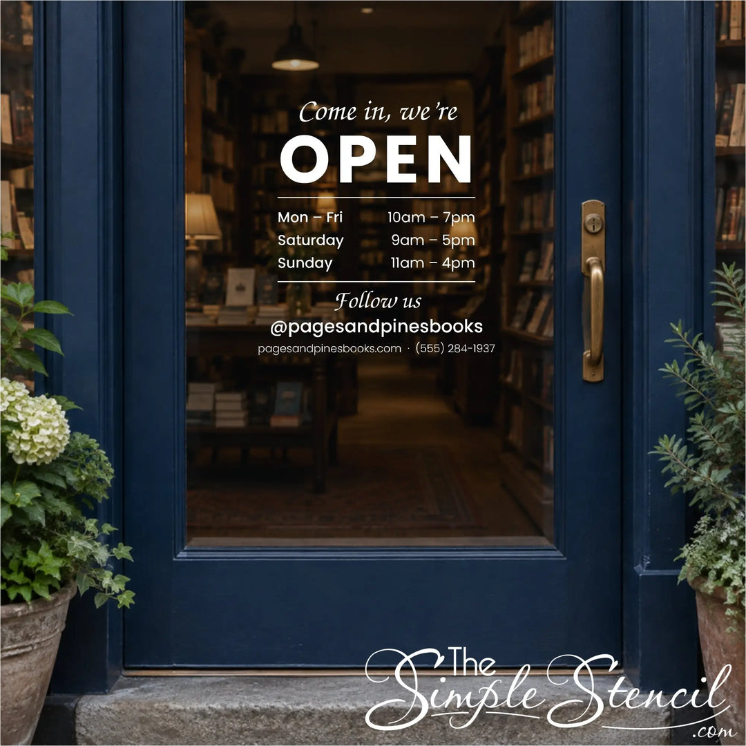 Open sign vinyl decal with store hours and Instagram handle on a bookstore's glass door
