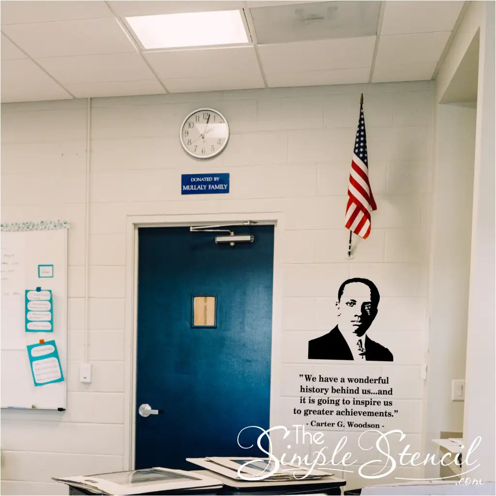 Classroom interior with a blue door, American flag, and motivational quote on the wall by Carter G. Woodson
black history month display below flag. 