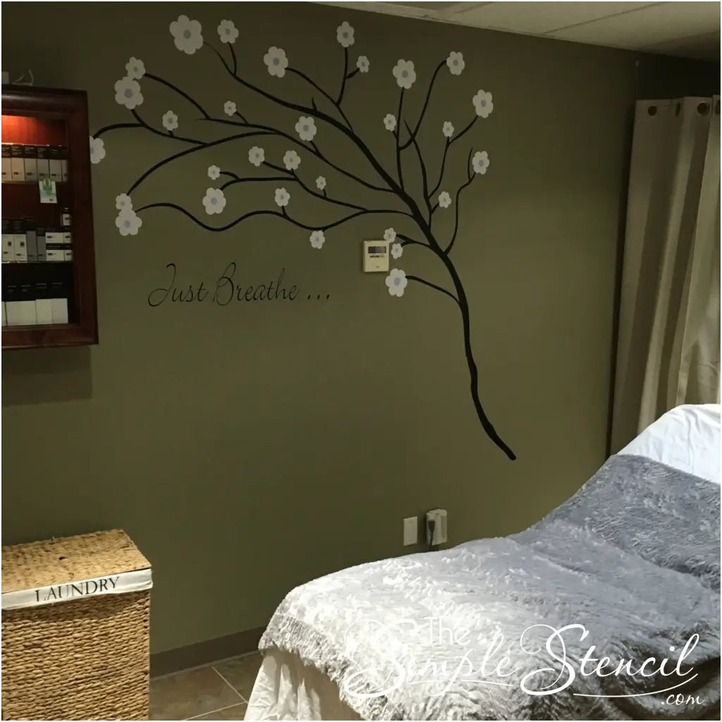 Cherry blossom tree wall decal by The Simple Stencil applied to the wall of a spa to generate a sense of peace and serenity while beautifying the empty wall space.