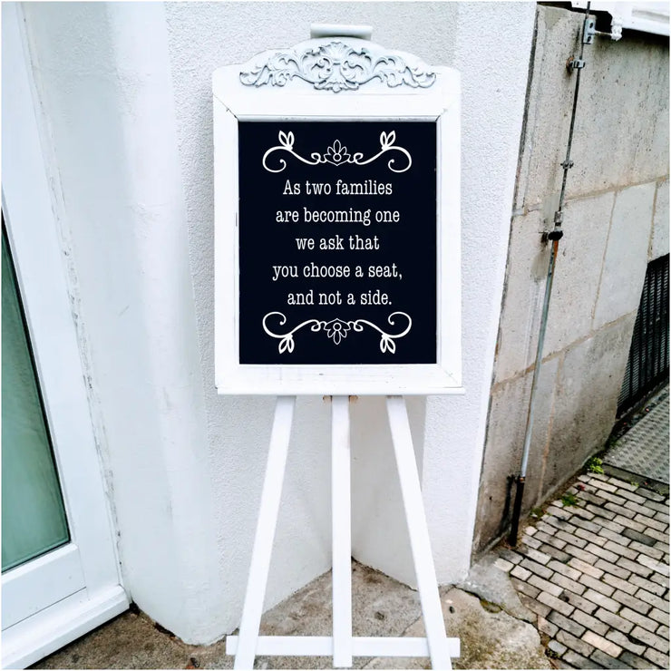 Choose A Seat Not Side - A cute wedding sign display to encourage families to mingle at your wedding. Exclusive decal design by The Simple Stencil