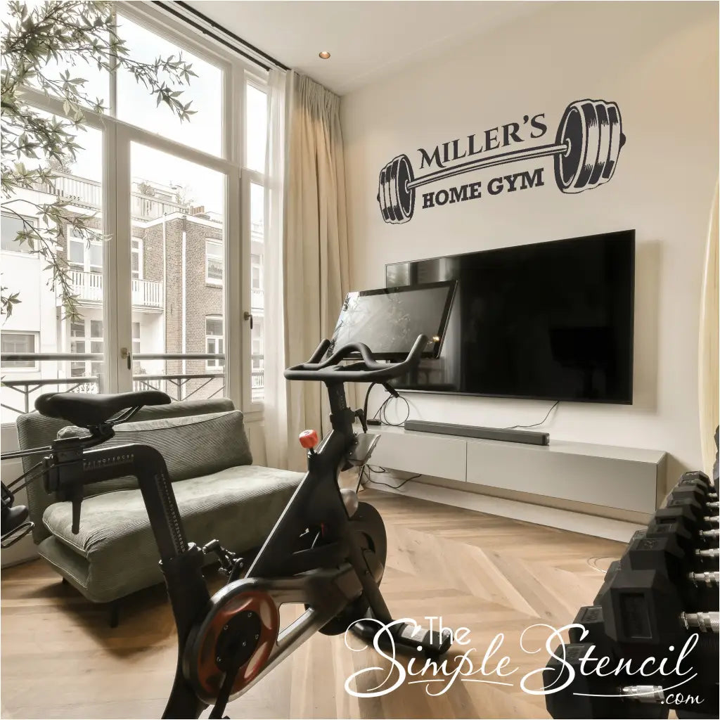 photo of the bent barbell graphic, highlighting the detailed design and fitness theme. Personalized home gym decor by The Simple Stencil