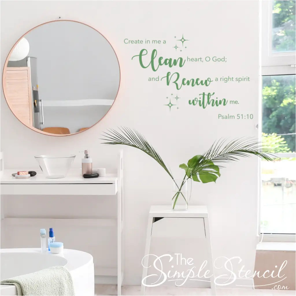 Modern bathroom with the "Create in me a clean heart" decal near a sink and mirror. 