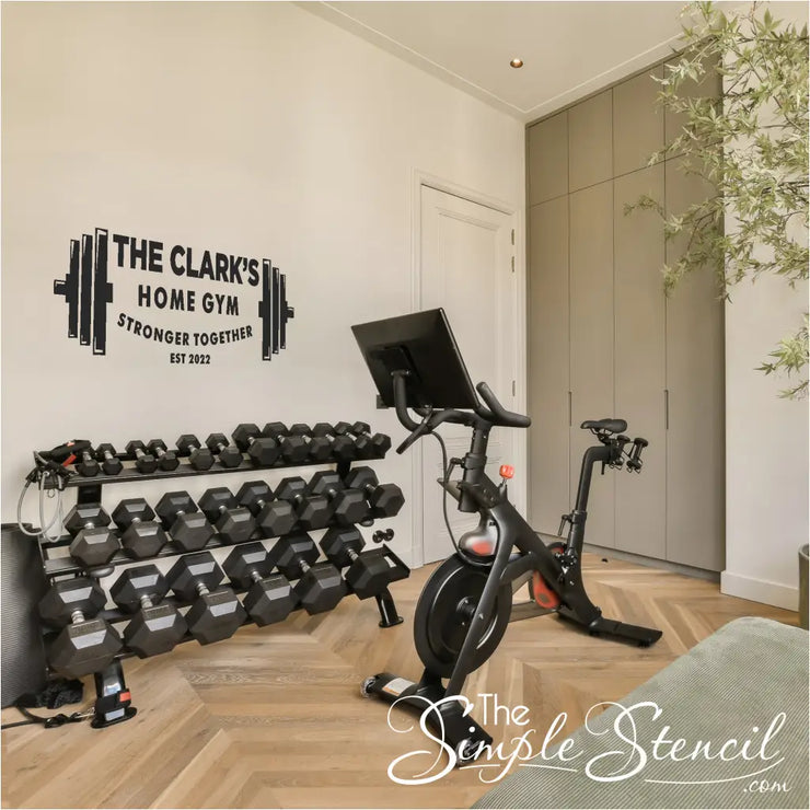 home gym with the decal visible in the background, emphasizing its ability to enhance the workout experience. This custom decal is personalized with your name and the words Stronger Together with optional Est. Year. 