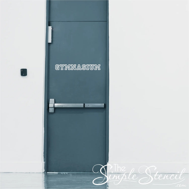 Dark gray metal gymnasium door with silver handle featuring high quality custom name decals now at low cost