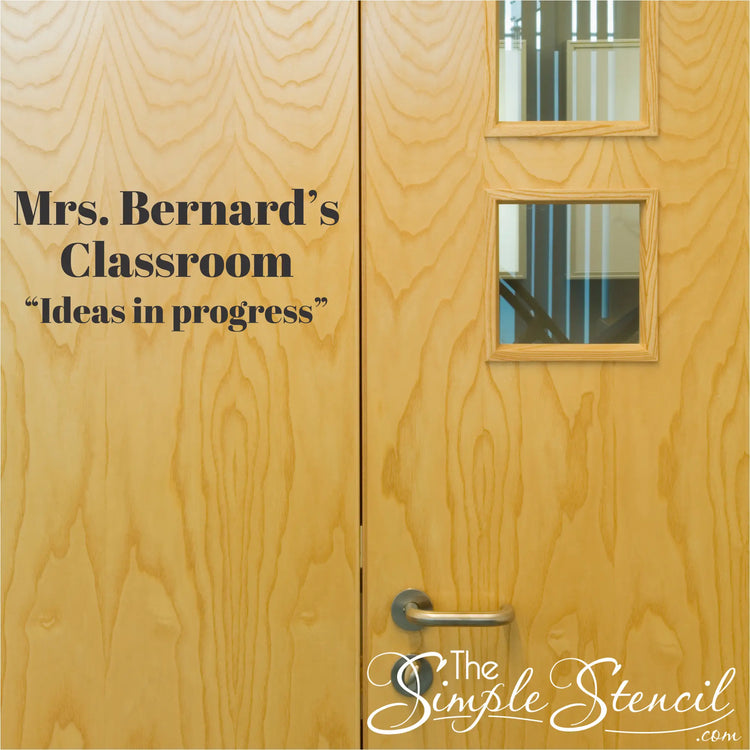 Light-colored wooden classroom doors with square glass panels and metal handle featuring high quality custom name decals now low cost