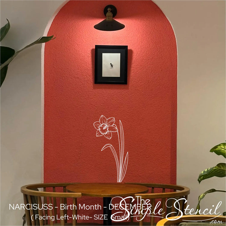 White Narcissus hopeful winter floral accent applied within a terracotta red arched niche above a cafe table.
