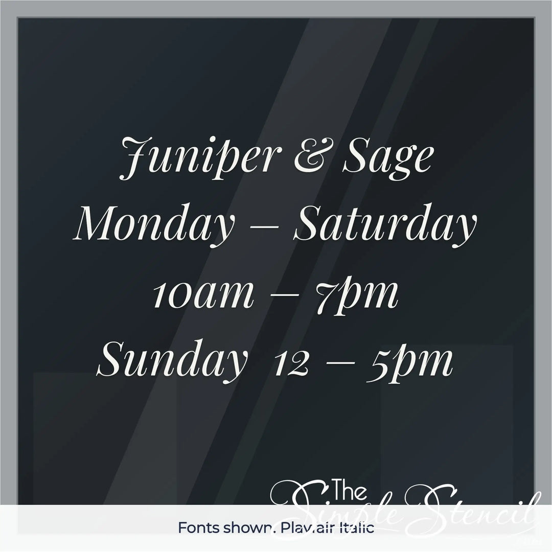 Custom boutique store hours decal example in Playfair Italic font, white vinyl on glass door