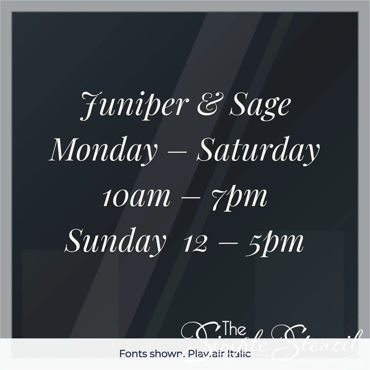 Custom boutique store hours decal example in Playfair Italic font, white vinyl on glass door